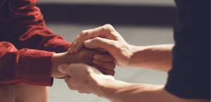 two people holding hands