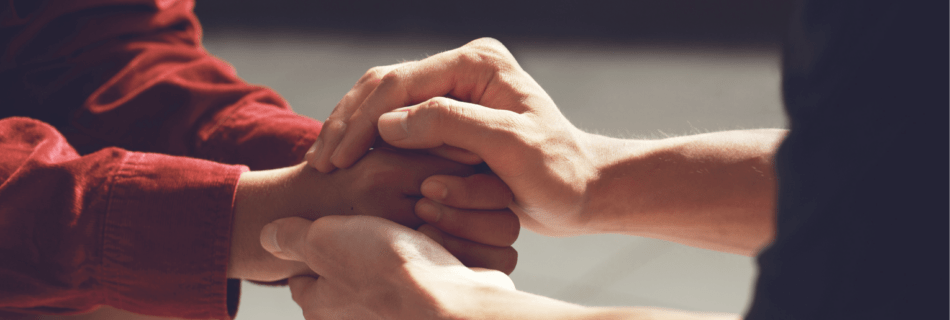 two people holding hands
