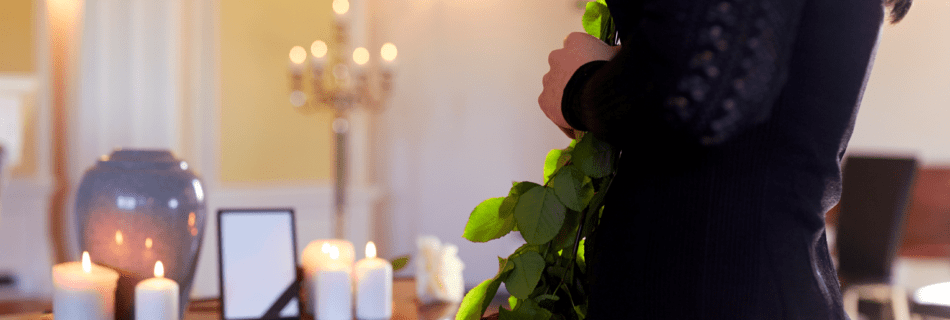 Mourning Woman with lit candles and urn