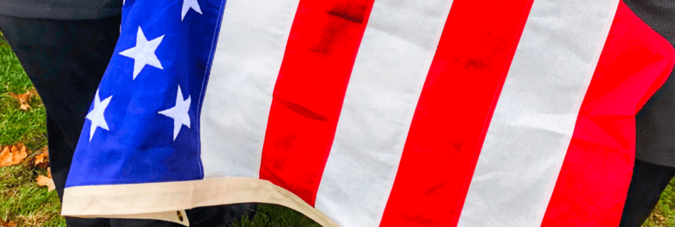 United States Flag draped over casket during a funeral