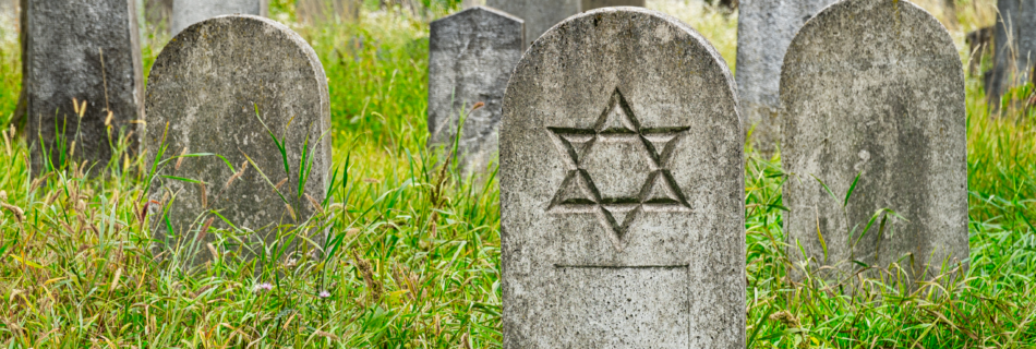 Cemetery with headstones with a Jewish symbol