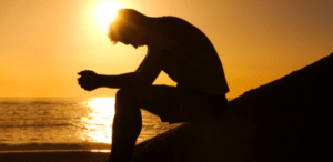 Shadow of person with sunset in the background