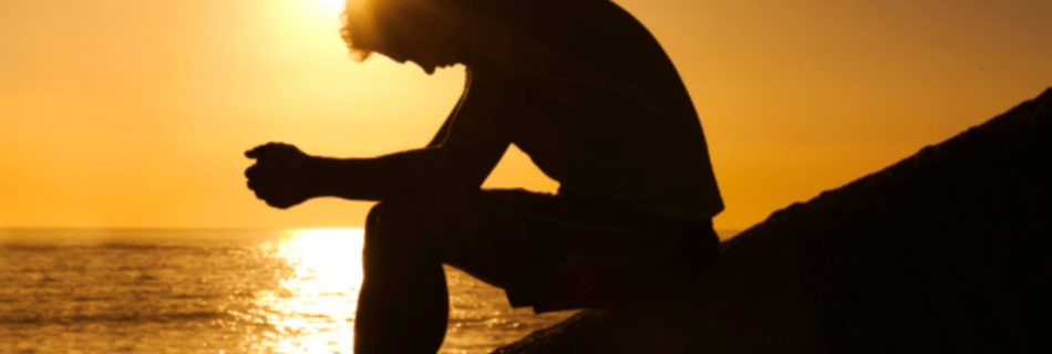 Shadow of person with sunset in the background