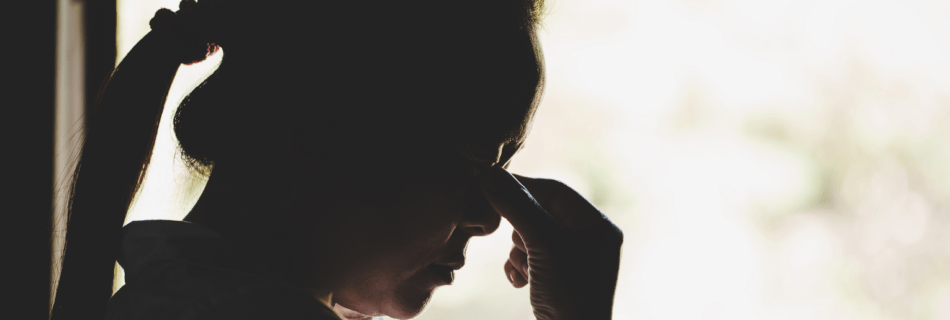 Shadow of grieving person after a loved one dies from suicide