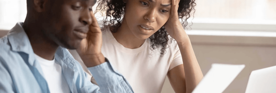 concerned couple trying to file taxes